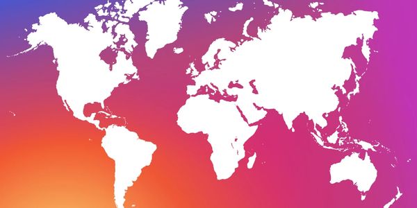 A world map with a pink, purple and orange background to signify social media marketing