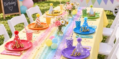 Colorful kids' birthday party table with name plates and party hats.