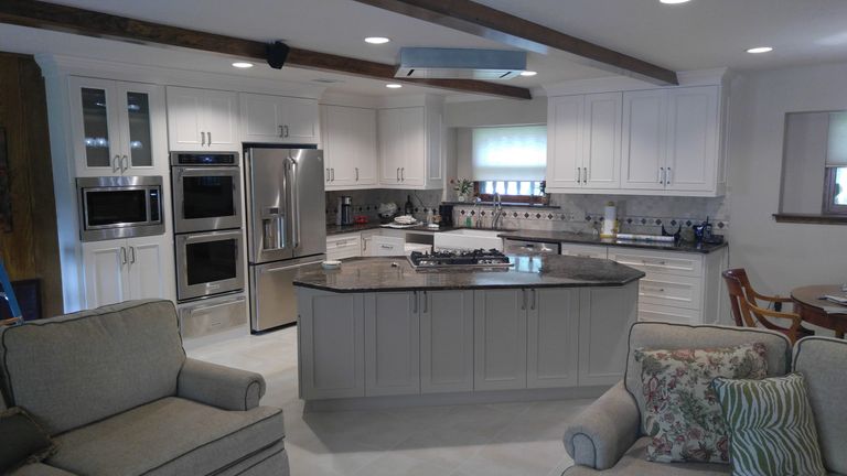 This Full kitchen remodel: Modification of Walls and cabinets, painting and countertop and tile work