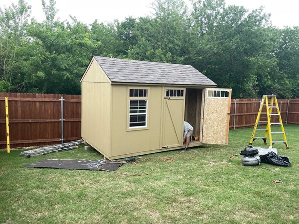 Wooden storage shed assembly.
