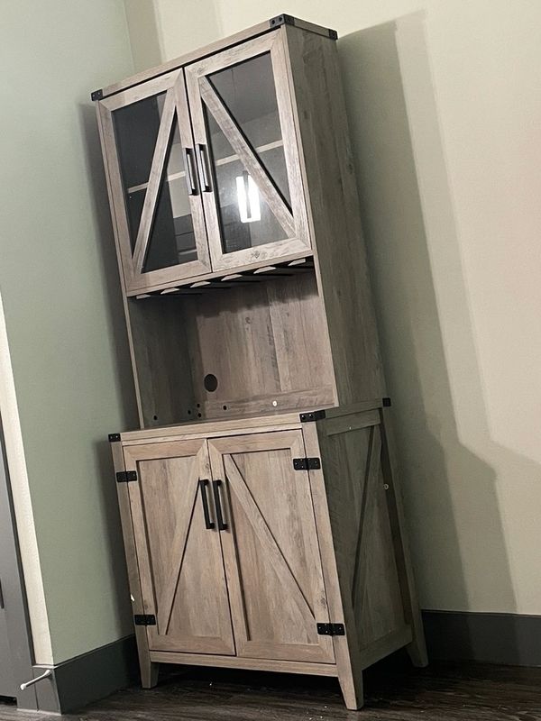 Stand up wooden wine cabinet with glass doors and wine glass rack assembled.