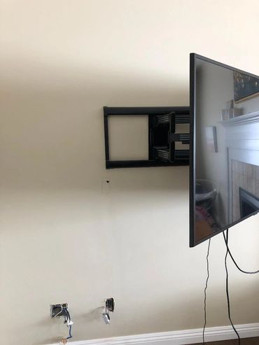 Moving TV socket and low voltage socket behind the TV