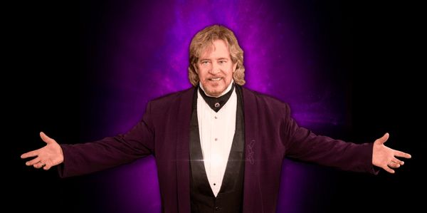 “Brett Shaw performing as a corporate magician at a Fortune 500 event.”