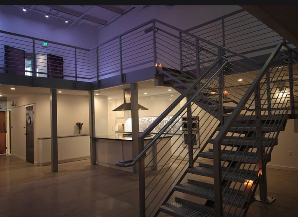 Fabricated in 2015, this Metal and concrete staircase is located in an art gallery in San Francisco.