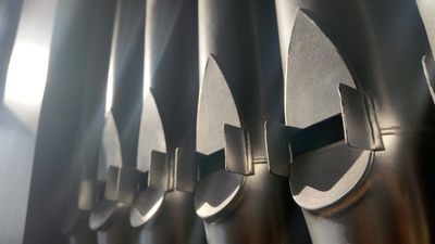 photo of organ pipes is a row