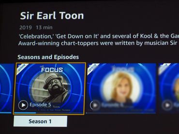 Sir Earl toon icon on Focus show with hat and glasses and brick wall