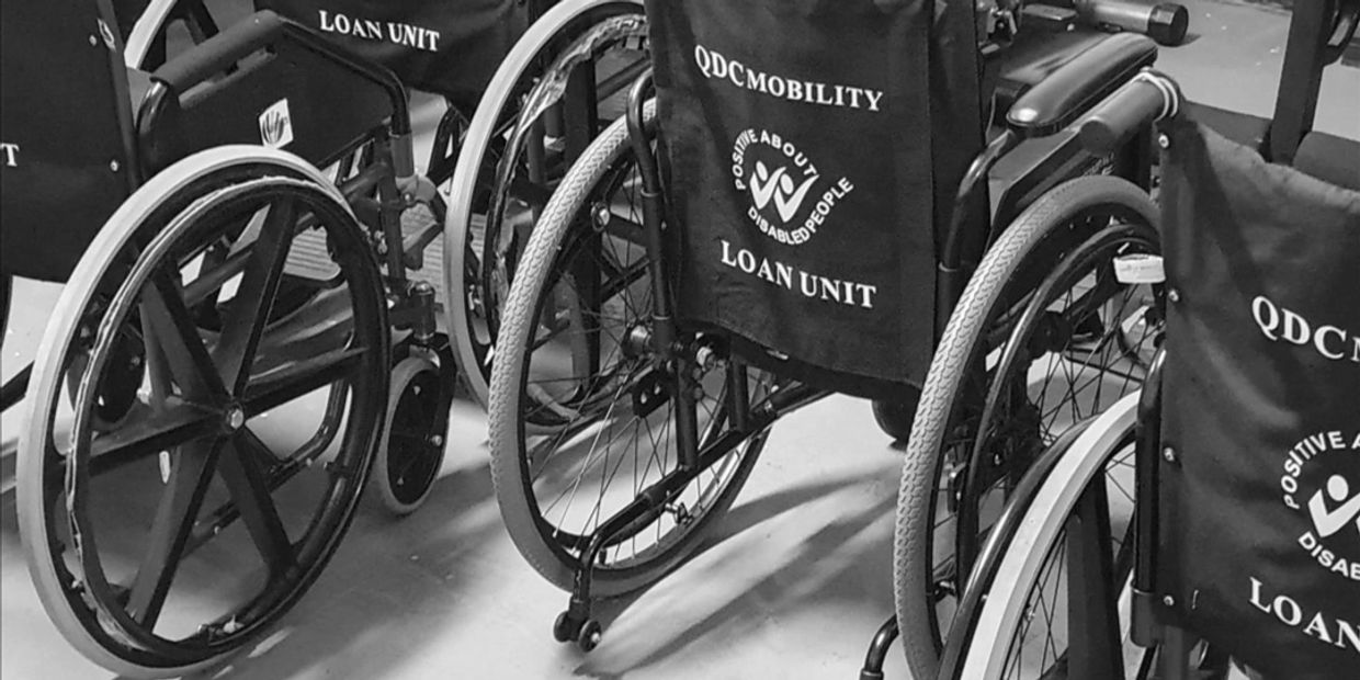 Several wheelchairs labeled as loan units for disabled people.
