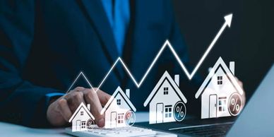Businessman analyzing rising real estate market trends on digital interface.