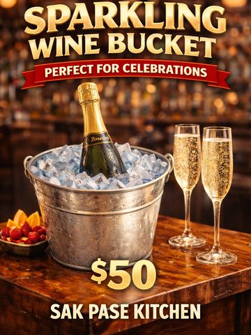 Sparkling wine bucket with Prosecco and two filled glasses, perfect for celebrations.