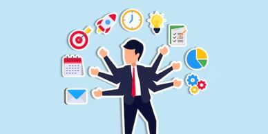 Businessman multitasking surrounded by productivity icons.