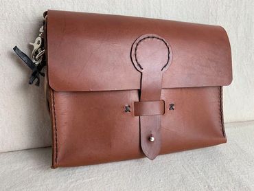 Ladies brown leather crossbody bag with adjustable shoulder strap,