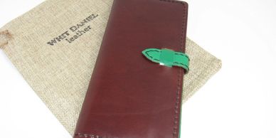 "The Charlotte" Women's Wallet, has 12 card slots and 2 large slots for notes/bills. Folds in half.