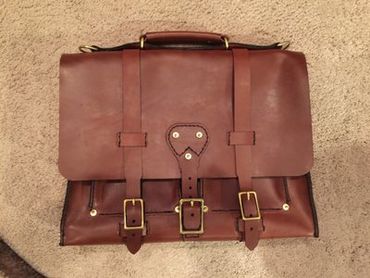 Lady's leather messenger bag, Custom  leather bags in Raleigh, NC. Comes with adjustable strap.