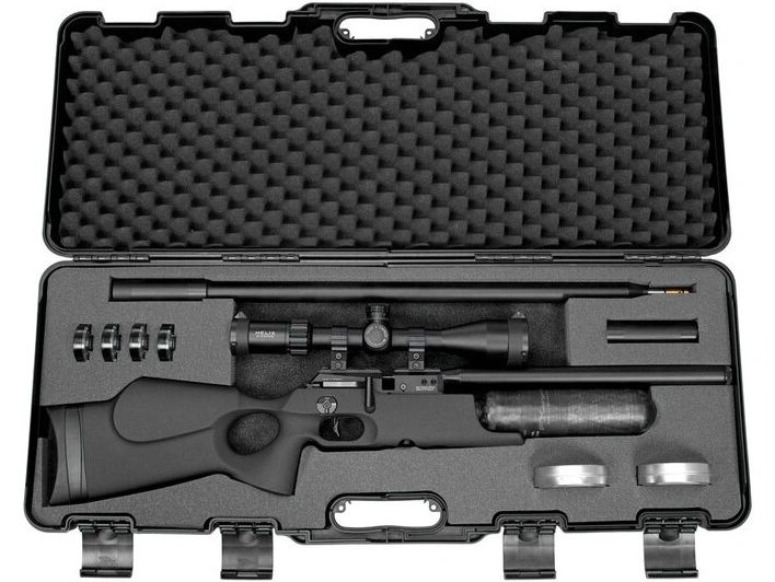 A precision rifle with scope and accessories neatly placed in a foam-lined hard case.