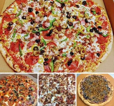 A large, fully topped pizza with various vegetables and meats.