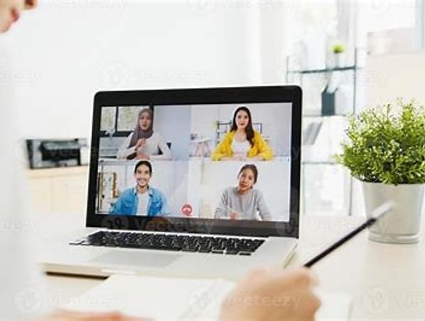 Person attending a video conference on a laptop with four participants.