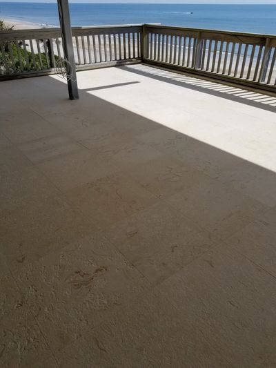 We used the same limestone on the main level deck but with a brushed finish