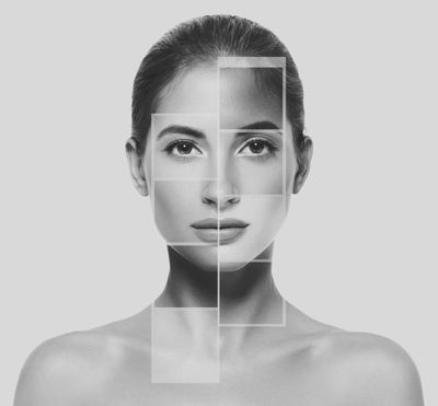Black and white portrait with geometric overlays highlighting facial features.