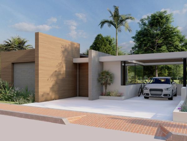 Modern house exterior with a car parked in a covered driveway and lush greenery.
