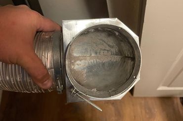A clean dryer vent hose that has been cleaned.