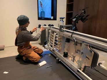 Queen Anne Handyman Repairing a Pilates Machine