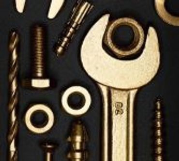 Pic of various nuts, bolts, screws, washers and a wrench.