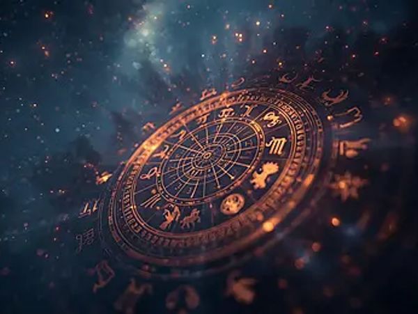 Glowing zodiac wheel with astrology symbols.