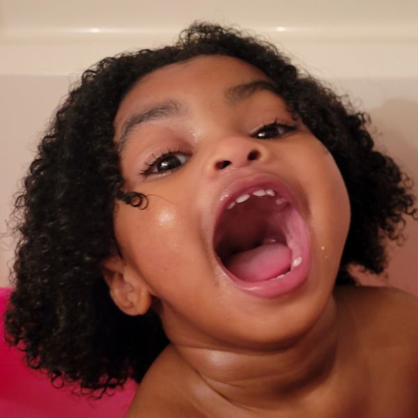 A happy baby enjoying bath-time!!