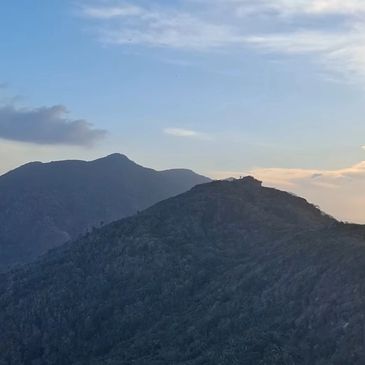 Mountain landscape with a clear sky at sunset.