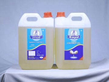 Two large containers of Royal coconut oil with orange caps.
