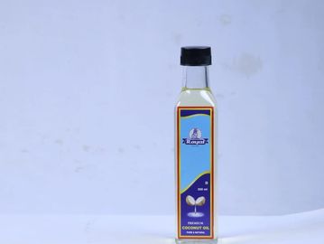 A bottle of organic coconut oil with a blue label on a plain background.