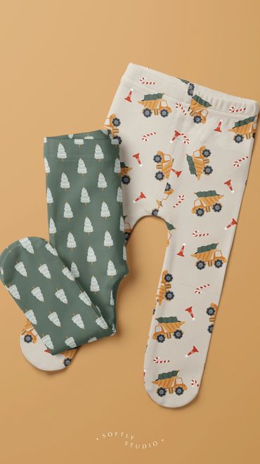 Two pairs of baby leggings: one with Christmas trees, the other with festive construction trucks.