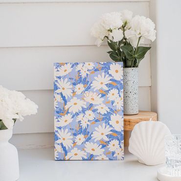 2024 teacher planner with blue daisy design beside vase of white flowers and White shell candle.
