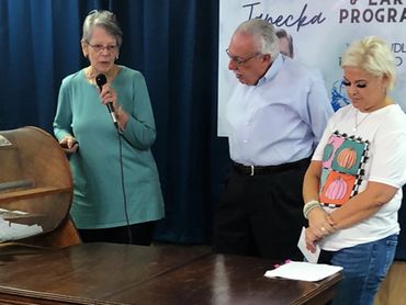 Pictured: Gabriel Project of the Crossroads Executive Director Linda Palmer, Brother Gary Moses and