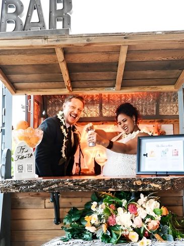 a bride and groom at a Bar