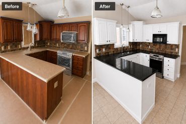 Kitchen transformation with white cabinets and black countertops replacing dark wood.