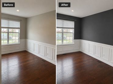 Room transformation with dark gray accent wall and white wainscoting.