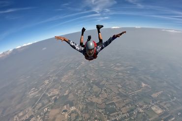 Skydiver mid-jump captured by a professional video service at XtremeZ Skydive