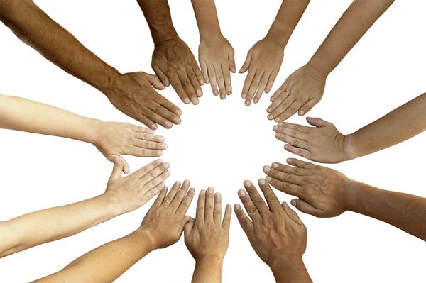 Diverse hands forming a circle on a white background.