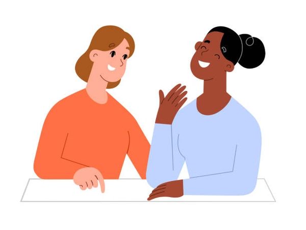 Two people smiling and talking.
