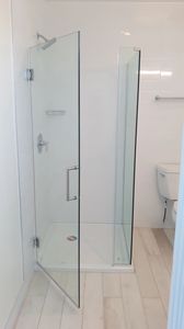 Frameless, 3/8 or 1/2 tempered glass.