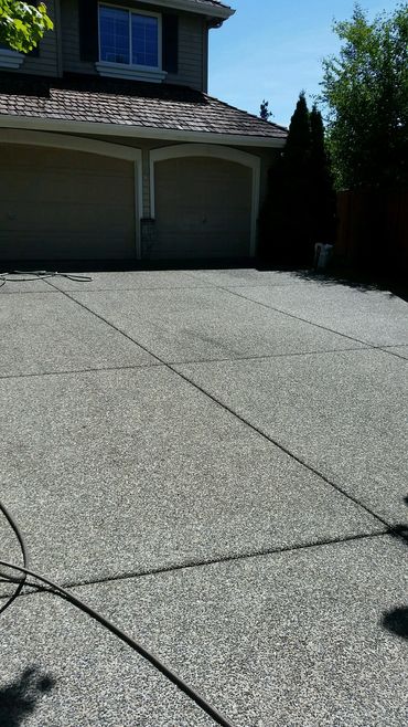 Pressure washing a driveway and walkways at a house in Bothell We also cleaned their roof and Gutter
