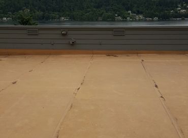 Cleaning a Flat level roof on a house in Bellevue. After cleaning it is used as a deck patio