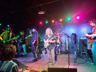 Lynyrd Skynyrd tribute band Freebyrd under multicolored stage lights at MT Barrels in Schaumburg, IL