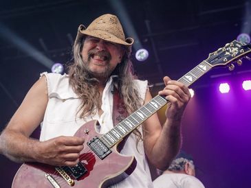 Mitch Wierzgac, guitar player in Lynyrd Skynyrd tribute band Freebyrd looking down at crowd