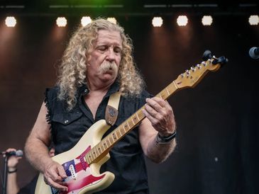 Ken Erickson, guitar player in Lynyrd Skynyrd tribute band Freebyrd performing on stage