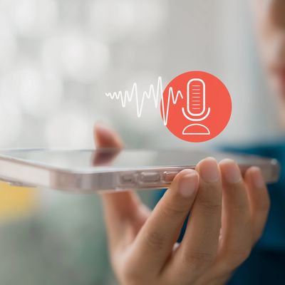 A person holding a smartphone with a microphone icon and sound waves displayed.