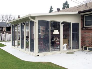 studio sunroom added to brick house