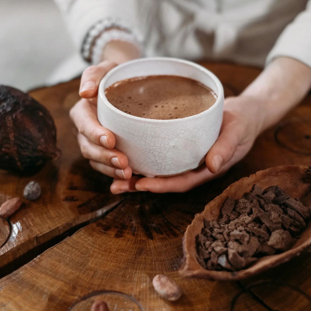 Female holding cup of ceremonial cacao