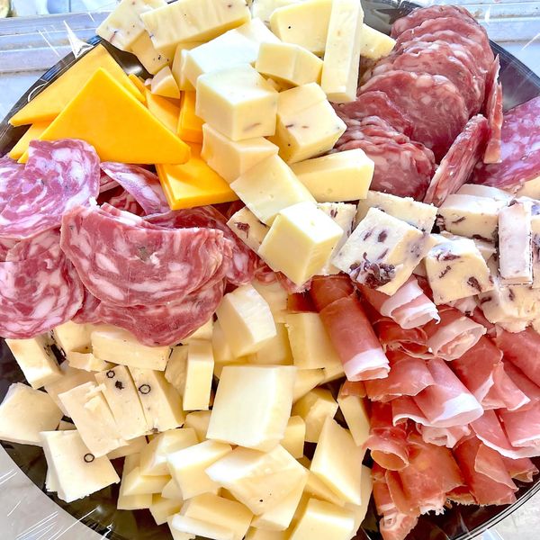 platter for antipasto catering appetizer of artisan cheese prosciutto sopressata dry sausage